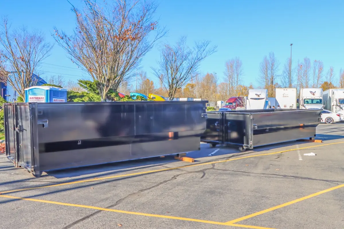 Professional dumpster rental service with roll-off container on residential driveway in Ladson